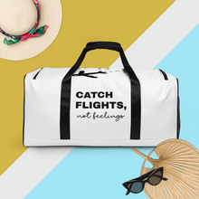 Load image into Gallery viewer, Catch flights, not feelings Duffle bag